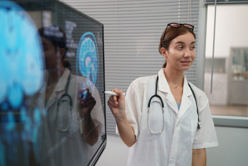 Medical Workplace Healthcare. Multiethnic doctor Team Wearing Medical Masks Having Meeting In Office