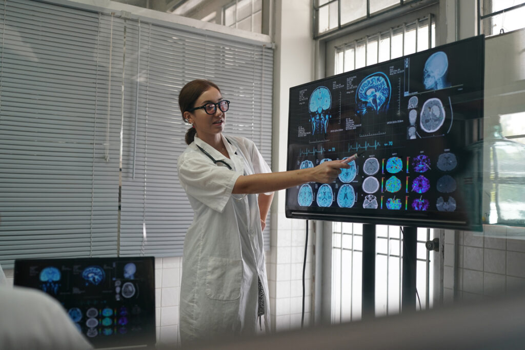 Medical Workplace Healthcare. Multiethnic doctor Team Wearing Medical Masks Having Meeting In Office