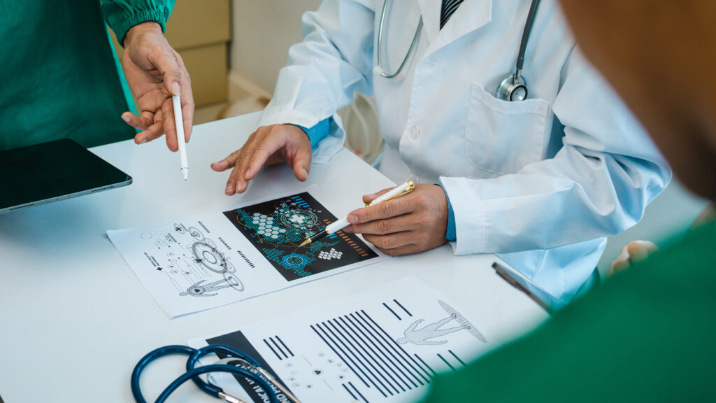 Meeting team of doctor and medical staff at hospital, Consultation about treatment of heart disease